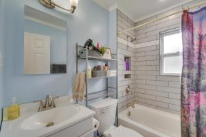 a bathroom with a sink and a toilet and a tub at Oak Ridge Retreat with Porch Less Than 1 Mi to Downtown in Oak Ridge +21 photos