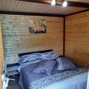 Un pat sau paturi într-o cameră la Mariem