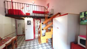 a small room with a bunk bed and a staircase at Appartamenti Adriana Sirmione in Sirmione