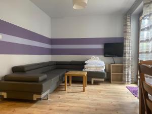 Posteľ alebo postele v izbe v ubytovaní Aba Apartamenty