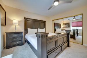 a bedroom with a large bed and a large mirror at Reno Getaway with Spacious Patio and Grill! in Reno