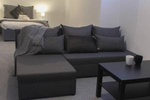 a living room with a couch and a table at Spacious 1Bed Apartment in Heywood near CC in Heywood