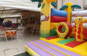 a colorful inflatable ride at a birthday party at Hotel La Vela in Bellaria-Igea Marina +16 photos