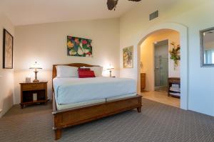 a bedroom with a large bed and a hallway at 3bd 3ba Oceanview Condo w Office and AC and WIFI and Garage ACAA1 in Kailua-Kona +27 photos