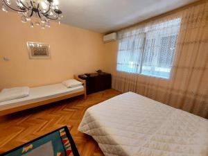 เตียงในห้องที่ Apartman Boljević