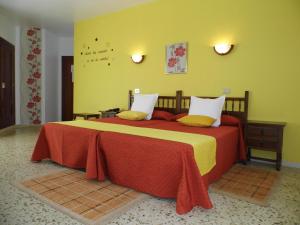 Postel nebo postele na pokoji v ubytování Hotel Arboleda