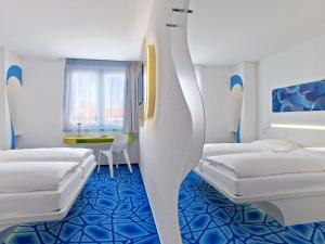 Postel nebo postele na pokoji v ubytování Prize by Radisson, Hamburg City