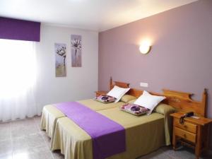 Postel nebo postele na pokoji v ubytování Hotel Arboleda
