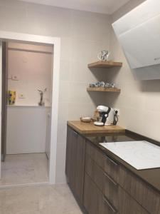 Kuchyň nebo kuchyňský kout v ubytování Hermoso Apartamento en Benicasim