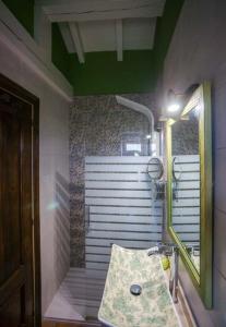 a bathroom with a sink and a shower at Posada Las Tres Mentiras de Santillana del Mar in Santillana del Mar