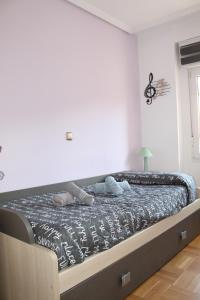 A bed or beds in a room at Corralón Tahonas. Centro histórico
