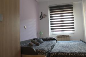 A bed or beds in a room at Corralón Tahonas. Centro histórico