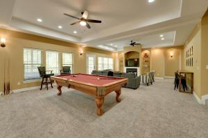 a living room with a pool table in it at 4 Mi to Branson Landing Huge Home with Game Room! in Branson