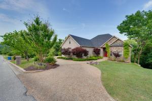 a home with a gravel driveway at 4 Mi to Branson Landing Huge Home with Game Room! in Branson