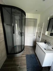 a bathroom with a shower and a sink at CLAREN appart 57 