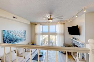 a living room with a staircase and a window at Karoll I Unit D in Ocean City