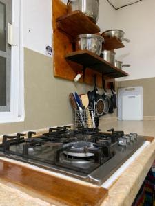 Η κουζίνα ή μικρή κουζίνα στο Kin Hostal and Camping