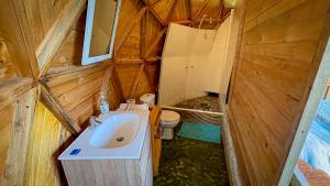 a small bathroom with a sink and a toilet at Glamping Magic Love in San Francisco