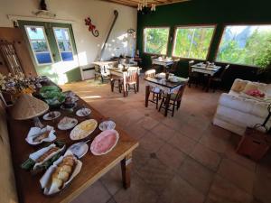 a living room with a table with food on it at Casa Ortmann in Canela