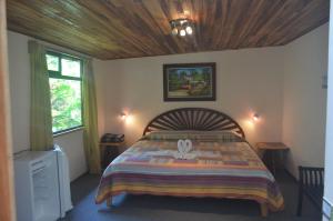 Säng eller sängar i ett rum på Historias Lodge