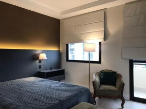 Postel nebo postele na pokoji v ubytování Q-Flat Hotel - Faria Lima