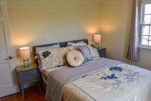 a bedroom with a bed with a pumpkin on it at Seaside Serenity, just a block /0.1 mile away from the beach in Yarmouth