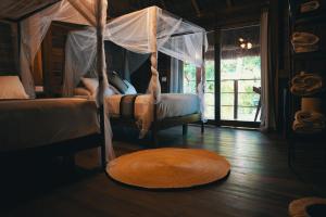 Postel nebo postele na pokoji v ubytování Bluebayou Bacalar + 20 fotografií