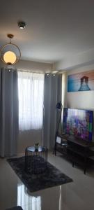 Simple and elegant 1 bed condo in Cebu city TV 또는 엔터테인먼트 센터