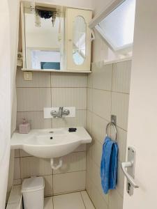 a bathroom with a sink and a mirror at Milena in Petrovac na Moru