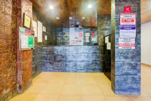 a hallway of a building with signs on the wall at Sea Breeze Beach Resort Candolim, Goa in Candolim