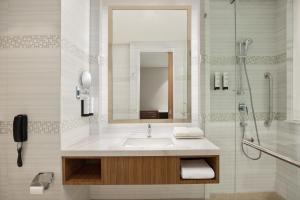 a bathroom with a sink and a shower at Fairfield by Marriott Agra in Agra