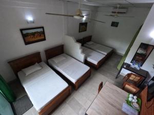 Säng eller sängar i ett rum på Ambalama Leisure Lounge