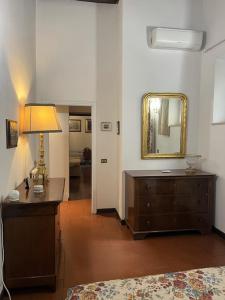 a living room with a dresser and a mirror at Annemary Maison in Rome