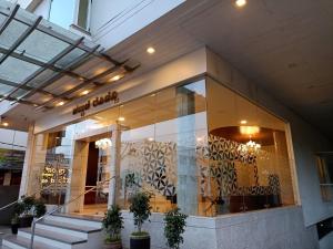 a store front of a building with a window at Palguni Residency in Hassan