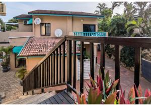 a balcony of a house with a house at Ocean View Villas in Ballito