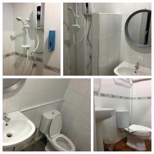 een badkamer met een douche, een toilet en een wastafel bij เกาะช้างรักดี รีสอร์ท 