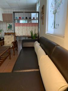 a living room with a couch and a table at 安禾居 AnHeJu B&B in Miaoli