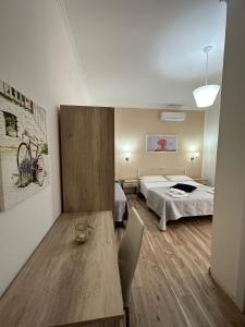 Posteľ alebo postele v izbe v ubytovaní Giardino dei Baroni house + 37 fotografií