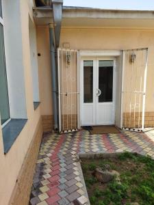 a front door of a building with a colorful floor at Family house in Tashkent