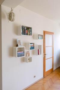 a room with white bookshelves on the wall at Cozy 2 bedroom apartment close to center in Split