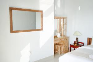 Alam Bali Beach Resort客房内的一张或多张床位