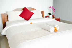 Alam Bali Beach Resort客房内的一张或多张床位