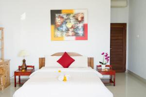 Alam Bali Beach Resort客房内的一张或多张床位