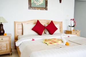 Alam Bali Beach Resort客房内的一张或多张床位