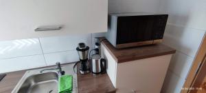 Kuchyň nebo kuchyňský kout v ubytování Ferienwohnung Groitzsch