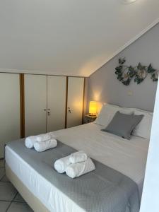 Postel nebo postele na pokoji v ubytování Emelia Apartment