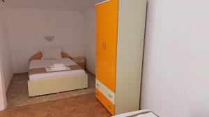 Postel nebo postele na pokoji v ubytování Krai Moreto Guest House