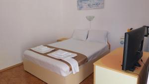 Postel nebo postele na pokoji v ubytování Krai Moreto Guest House