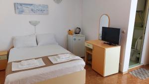 Postel nebo postele na pokoji v ubytování Krai Moreto Guest House