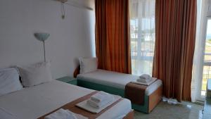 Postel nebo postele na pokoji v ubytování Krai Moreto Guest House